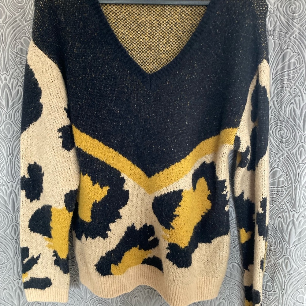 Animal print sweater. Size L but can fit XL. Very soft, not itchy. Like new